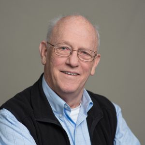 Picture of smiling person wearing glasses